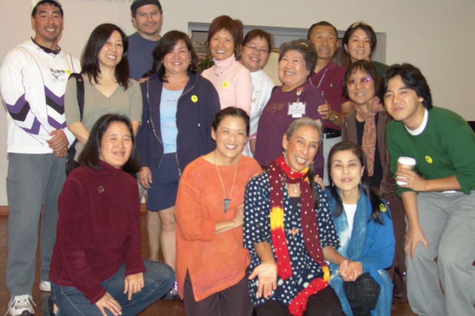 Attendees of Triangle Project: Journey of the Dandelion, gather for a photo